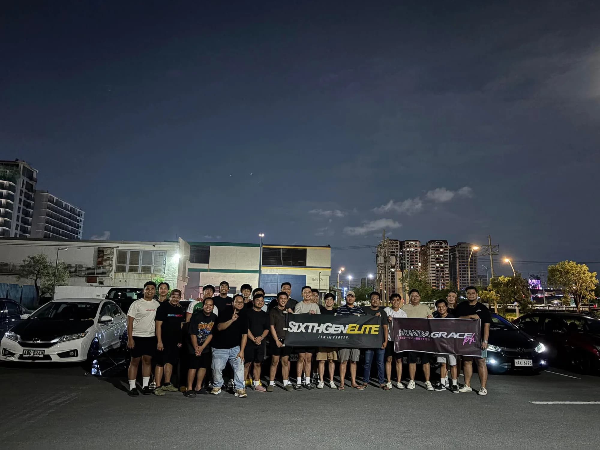 Honda Grace PH members posing with club banners at a night meet